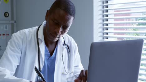 male doctor working at desk in the hospital