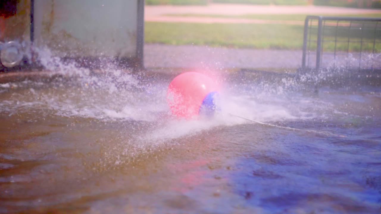 Super slow motion of a waterball game. Shot in 4K