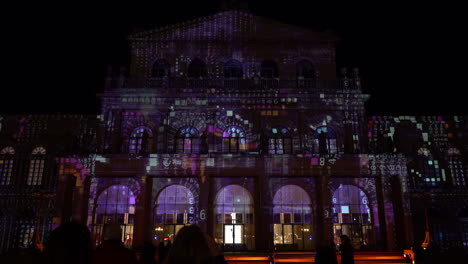 building facade with data projection mapping at night