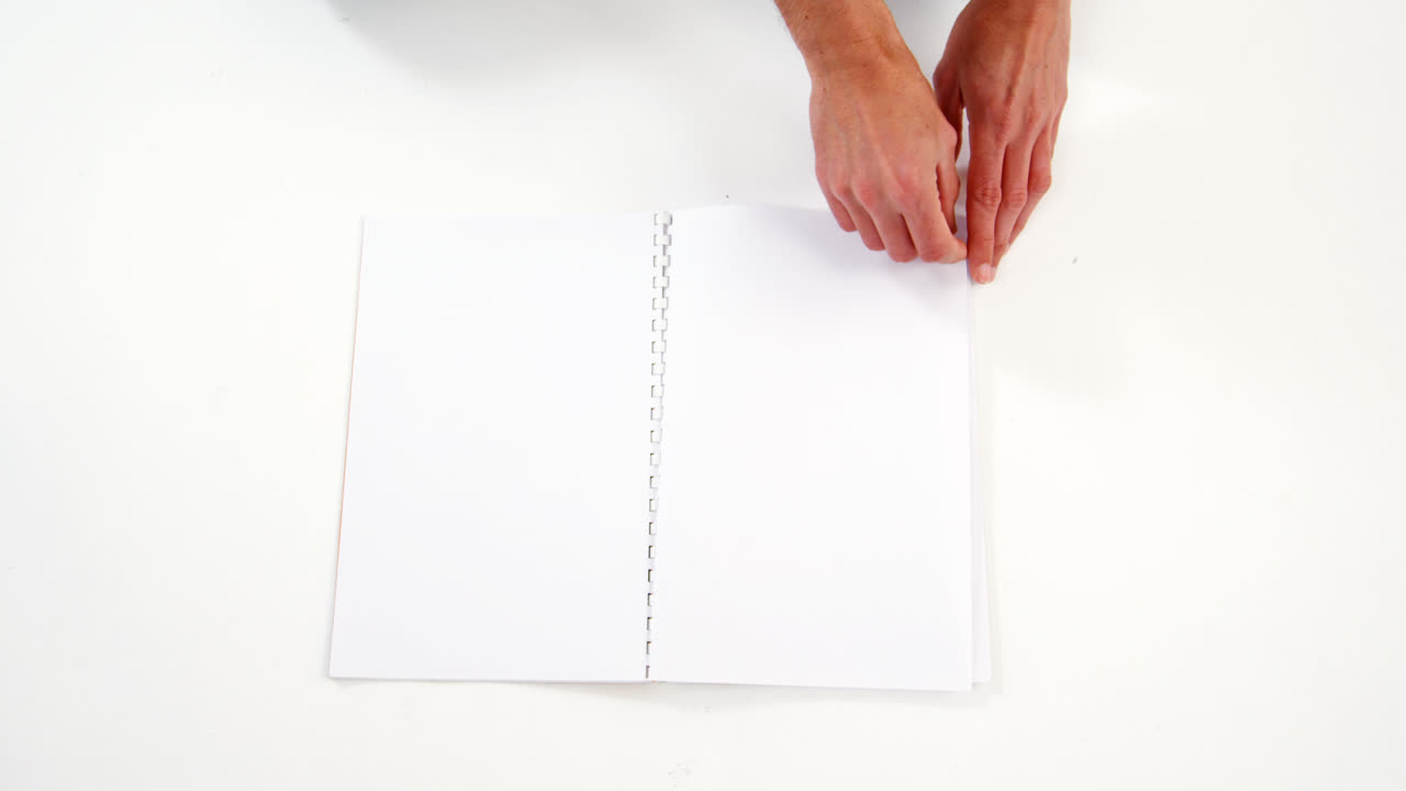 Man hand turning page of diary
