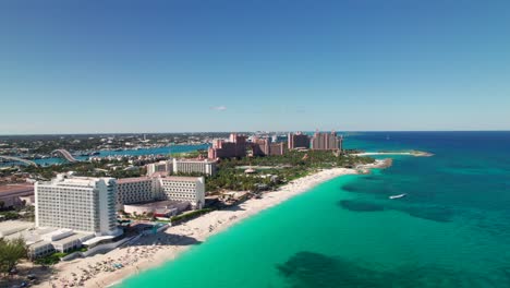 Drone-shot-of-Cabbage-Beach-and-Atlantis-Resort-in-Nassau,-Bahamas