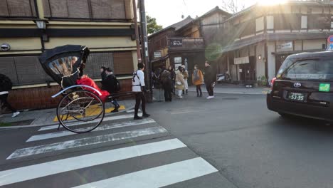 rickshaw crosses busy intersection amidst modern traffic