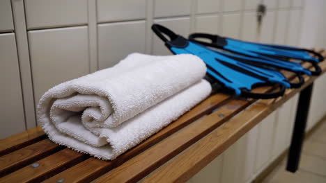 towels and flippers in a locker room