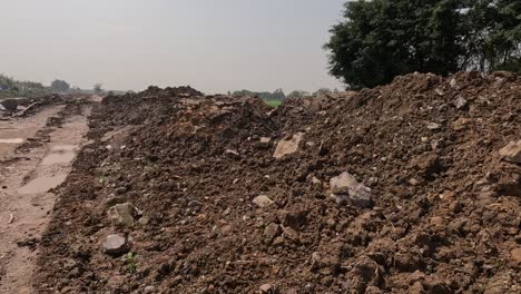 soil piled, road gradually taking shape