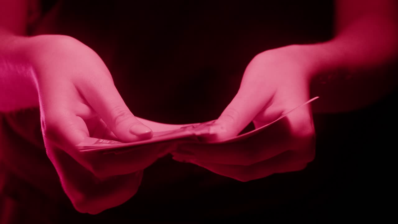 Hands holding euro banknotes