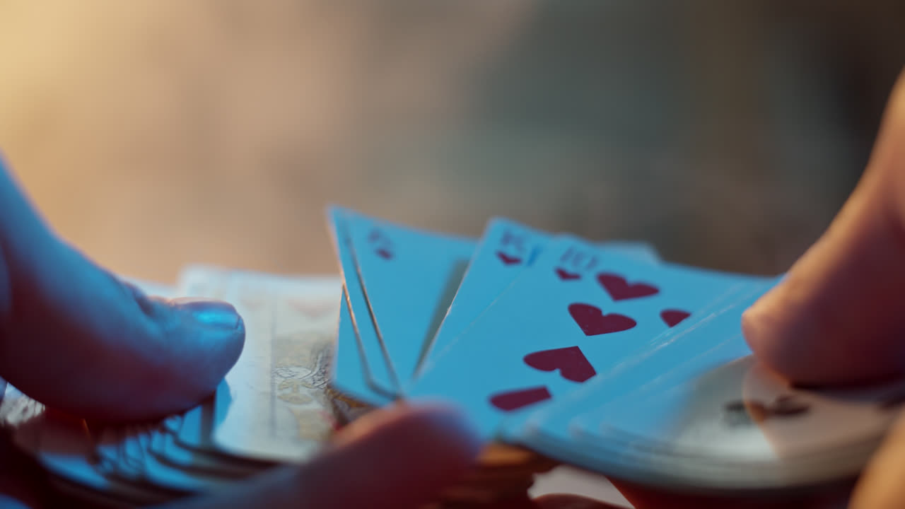 Close-up of hands shuffling playing cards