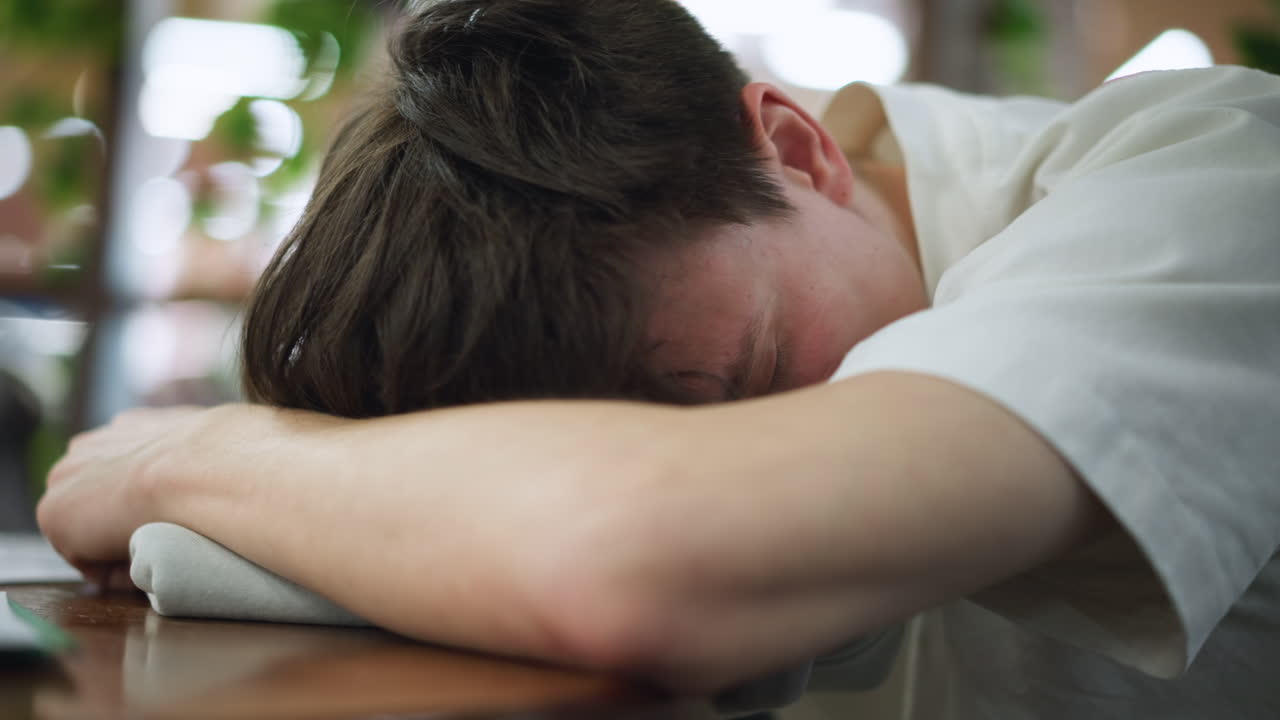 Close up view of brown curly hair strands tangled and tattered uneven ends showing mess under soft light conveying raw imperfect style details in slow shot for stylistic creative use