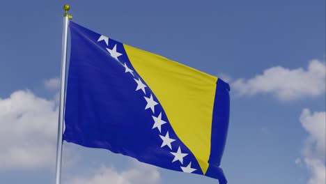 the flag of bosnia and herzegovina moving in the wind with a clear blue sky in the background, clouds slowly moving, flagpole, slow motion