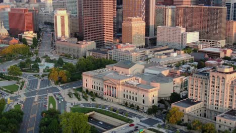 Aerial-pan-up-reveals-massive-Philadelphia-skyscrapers-during-summer-magic-hour-above-Ben-Franklin-Parkway-and-City-Hall