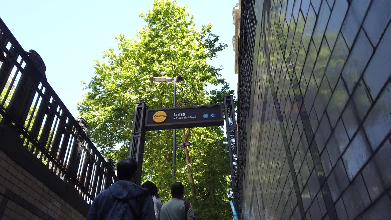 Underground subway exit POV at buenos aires city, people go upstairs subway, metro entrance