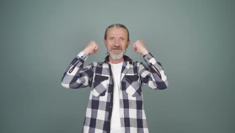 man clapping excitedly to camera.