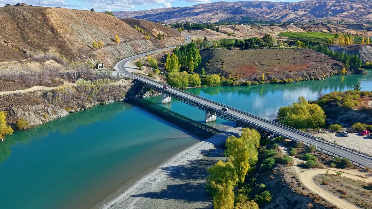 A serene bridge over Kawarau River in Bannockburn, New Zealand, scenic views