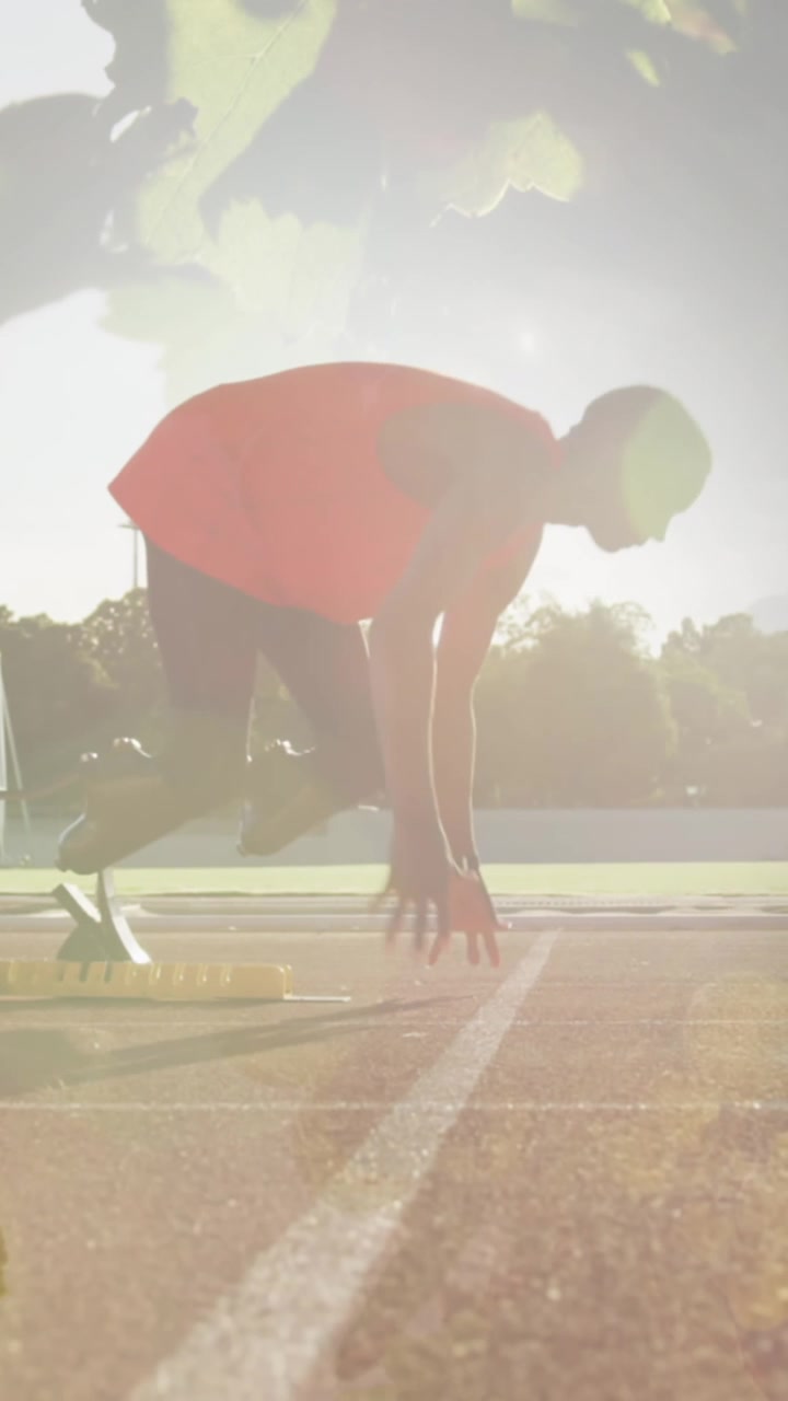 Animation of leaves over disabled african american male runner