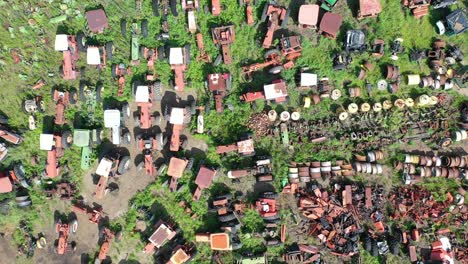 aerial view of a junkyard filled with old farm equipment