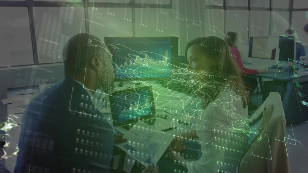 Man reading reports woman turning comparing laptop charts holo map linking screens finance deciding
