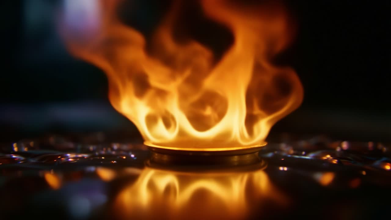 Captivating Flames Erupt from a Metallic Base, Creating a Mesmerizing Dance of Fire Reflected in Surrounding Surfaces and Shimmering Light