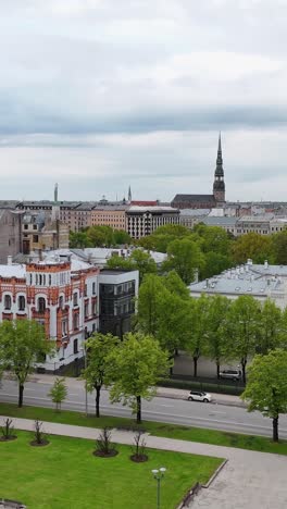 greenery flows through stunning architecture at the vertical esplanade in riga, latvia.