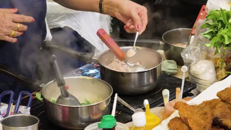 street food vendor cooking thai noodle soup