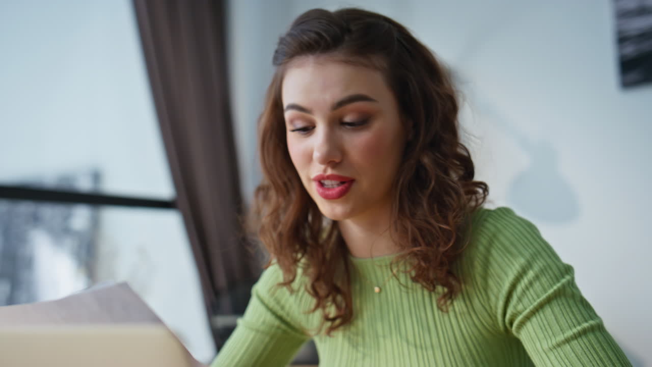 Positive girl studying online talking laptop desk closeup. Woman video calling