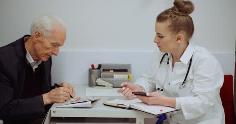 senior man at the doctor at health clinic 2