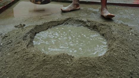 poor working condition in indian construction site barefoot labor close up