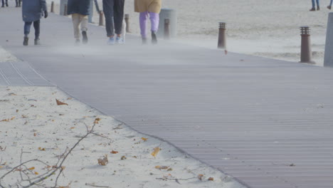 wind blowing on the boardwalk laid out along the beach