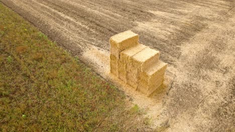 Aerial-View-of-Square-Hay-Bales-in-the-Farmland