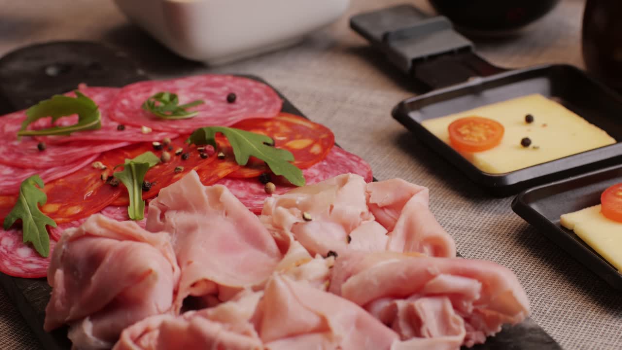 Italian or Spanish restaurant with traditional tapas food, Spanish cuisine, delicious tapas and cheese plate, bruschetta with cheese, olives dry tomatoes and tasty sandwich bar appetizer, buffet