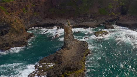 Aerial-orbiting-view-Of-Cathedral-Rocks-and-Foamy-Waves-In-Kiama-Downs,-NSW-Australia