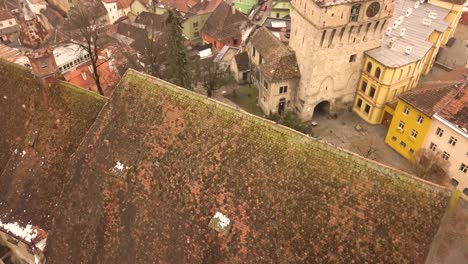 roof top view with some snow of famous buildings in the medieval town of sighisoara