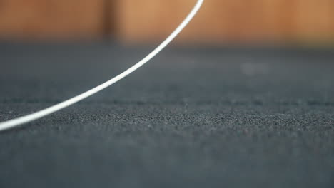 close up woman's hands grip a jump rope, ready to start a dynamic workout