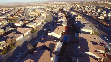 aerial over vast desert housing tracts suggests suburban sprawl