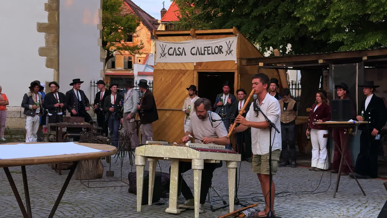 Sibiu, Romania, 1 July 2025: Traditional musicians performing at Sibiu festival. Local musicians in traditional Romanian costumes performing at an open-air festival in Sibiu