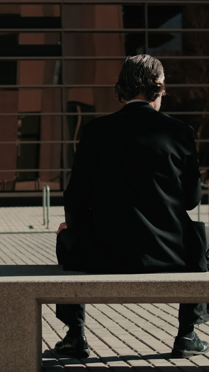 Businessman Contemplates Outside Office Building