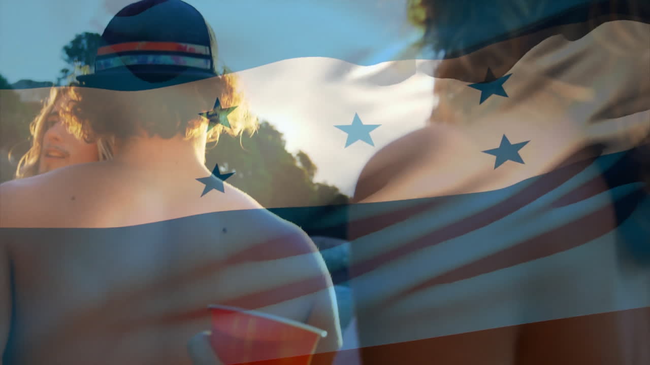 At beach, people relaxing with Honduras flag animation overlaying scene