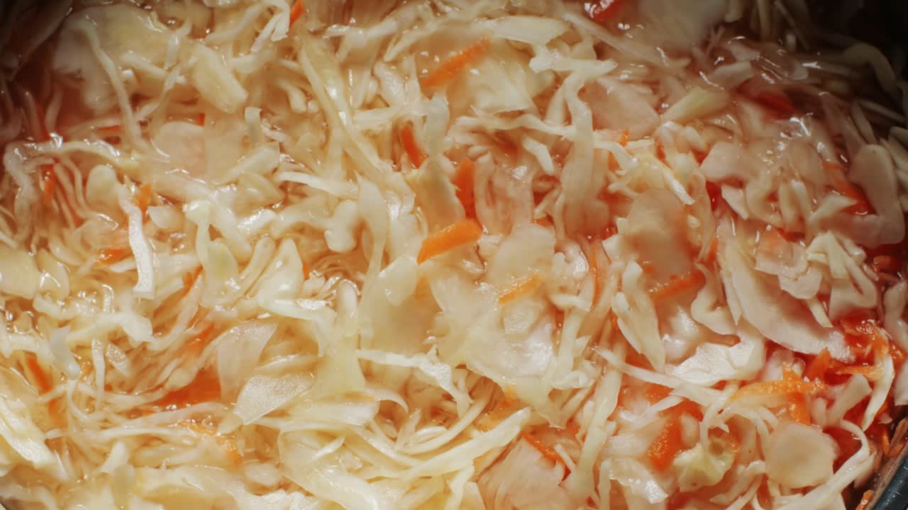 Sauerkraut fermented cabbage variety preserving jars. Homemade Sauerkraut with Carrot and Salad Cabbage with Beetroot on a wooden table. Fermented food.