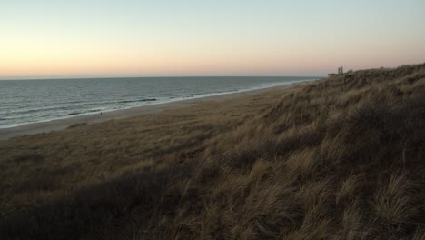 Dunes-with-the-sea-and-the-beach-in-the-background-after-the-sunset-on-Sylt