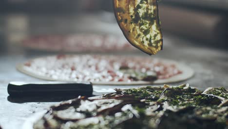 Preparing-vegetarian-pizza-in-restaurant-kitchen