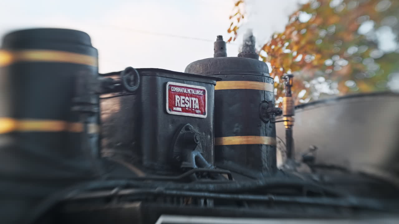 View of the wound-up steam train Mocanita on a railway station, Romania. Lensbaby effect