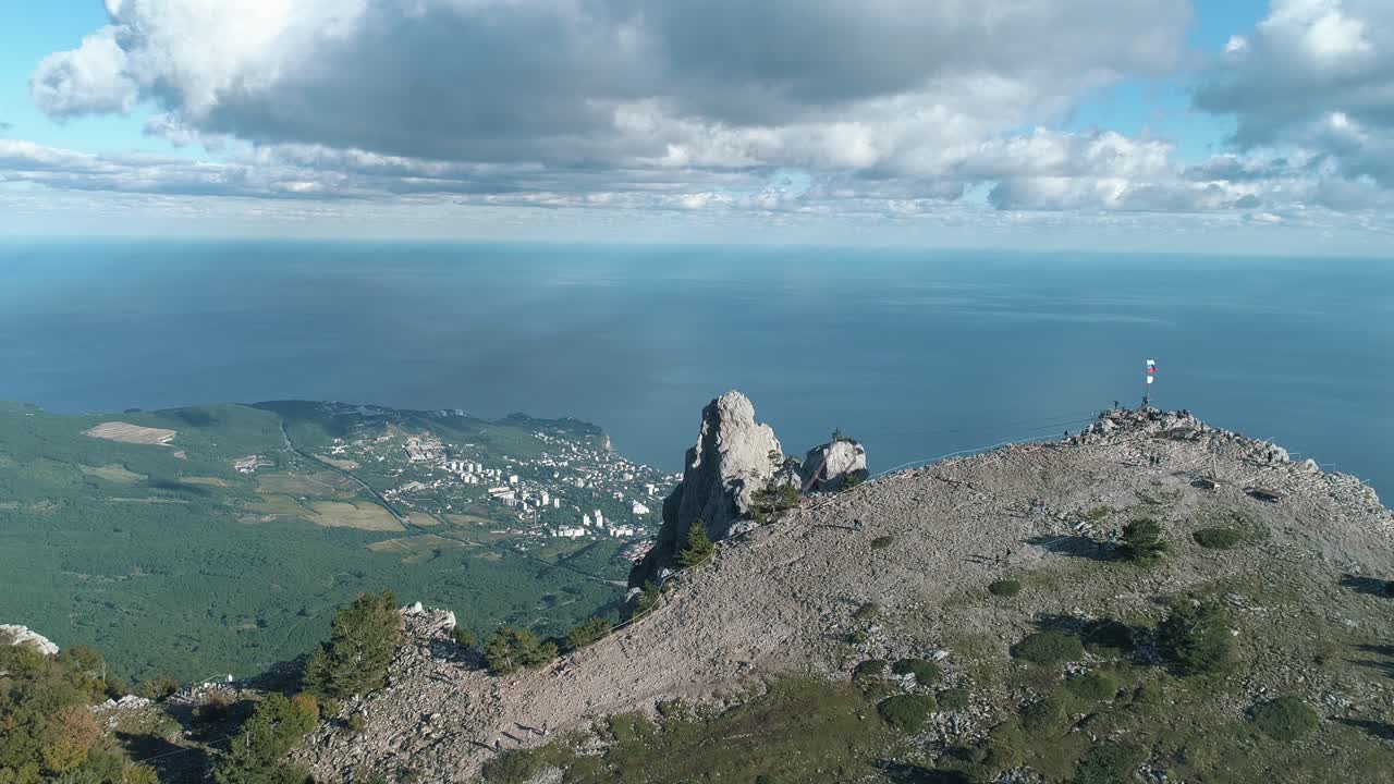 Mountain Peak View with Coastal City and Ocean