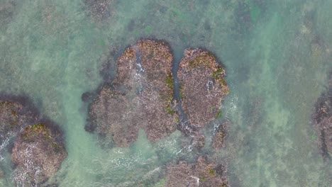 aerial view of rocky coastline with waves