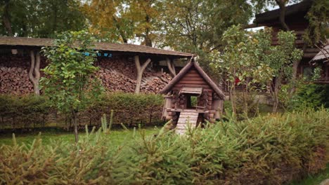 rustic wooden playhouse in a garden setting