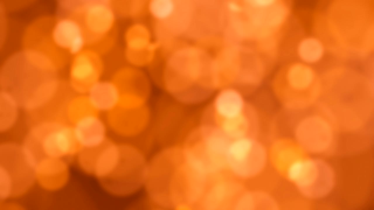 Faíscas de luz cintilantes, câmera lenta, fundo abstrato desfocado 4K