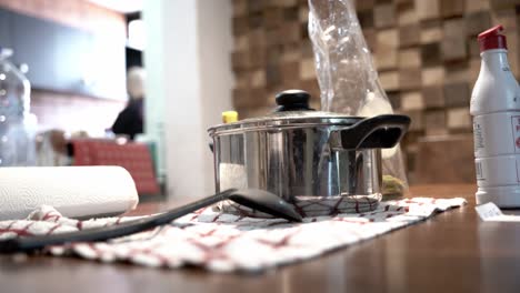 pot on the table with some food inside