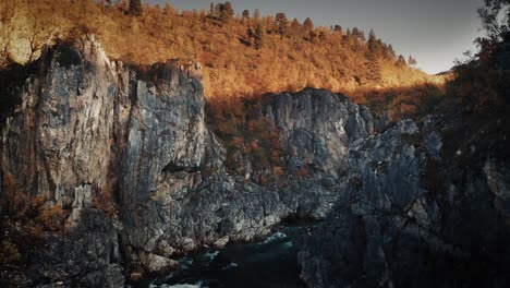 aerial view of the mountain river flowing slowly in the deep gorge