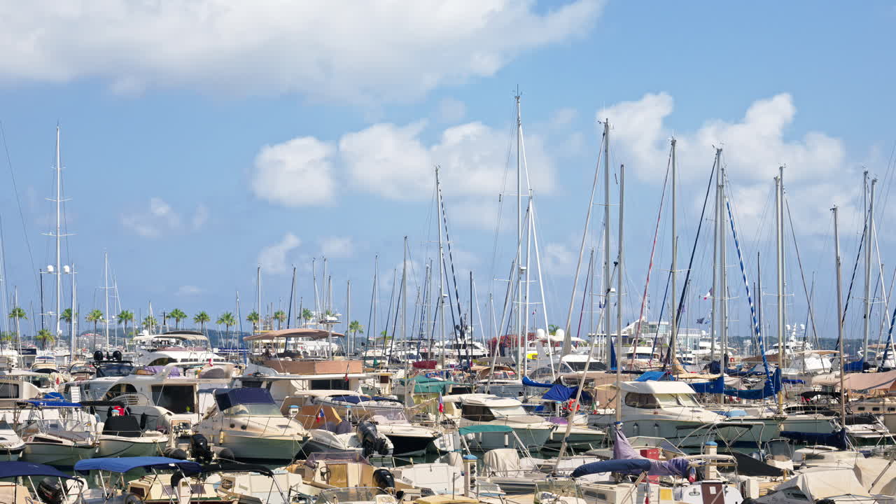 Multiple white boats docked in the harbour of Juan-les-Pins, France
