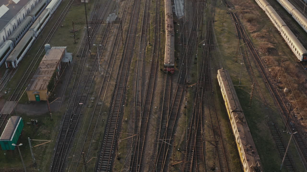 Aerial view of a train station with multiple tracks and trains