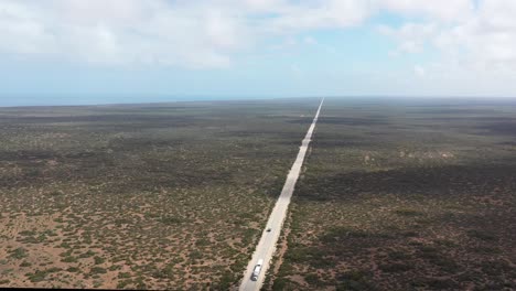 Excellent-Aerial-Shot-Of-Cars-Driving-Towards-The-Great-Australian-Bight-In-South-Australia