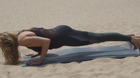 beautiful woman doing several yoga poses in sand dunes