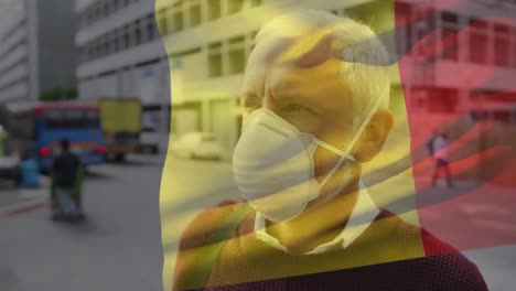 animation of flag of belgium waving over man in face masks